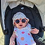 Claire a rejoint le concours — aidez-le/la à gagner de superbes lots ! baby, child, stroller, sunglasses, hat, smile, happy, polka_dot, clothing, sunshine, outdoor, seat, infant, cute, relaxed, summer, playful, headwear, person, fun