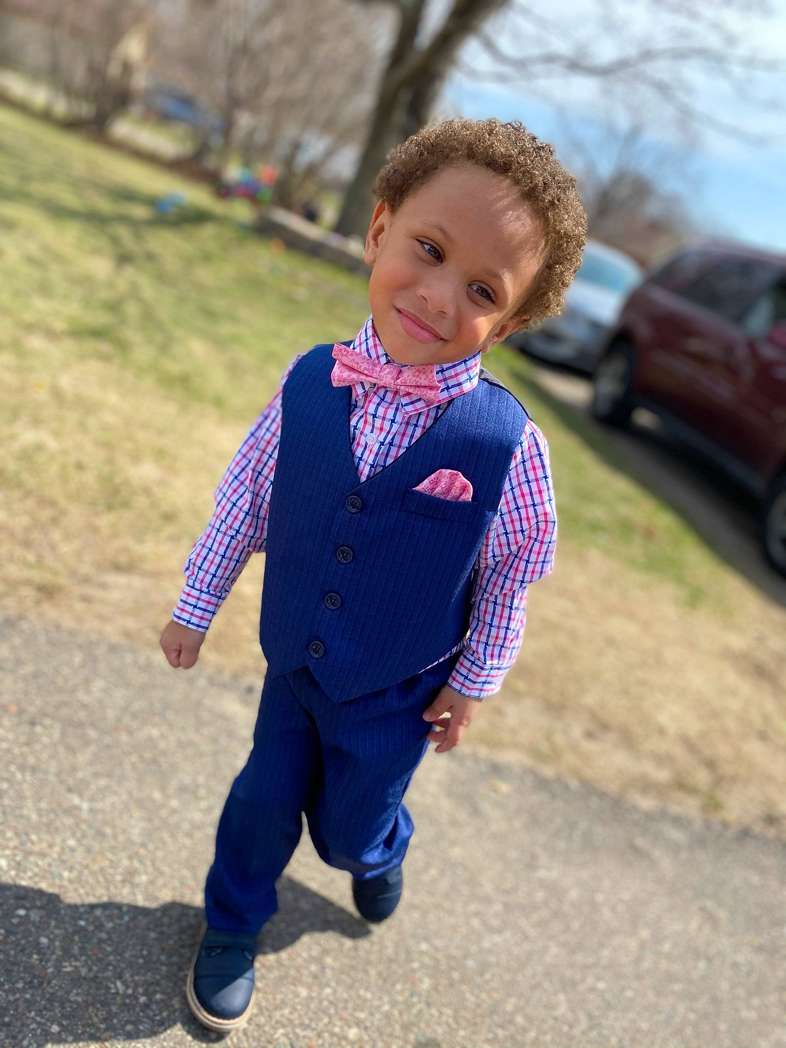 Rashawn is registered to the contest to win money with this photo: blazer, denim, electric_blue, face, formal_wear, grass, happy, human_body, joy, leisure, people_in_nature, person, plant, recreation, sky, sleeve, smile, street_fashion, tire, toddler