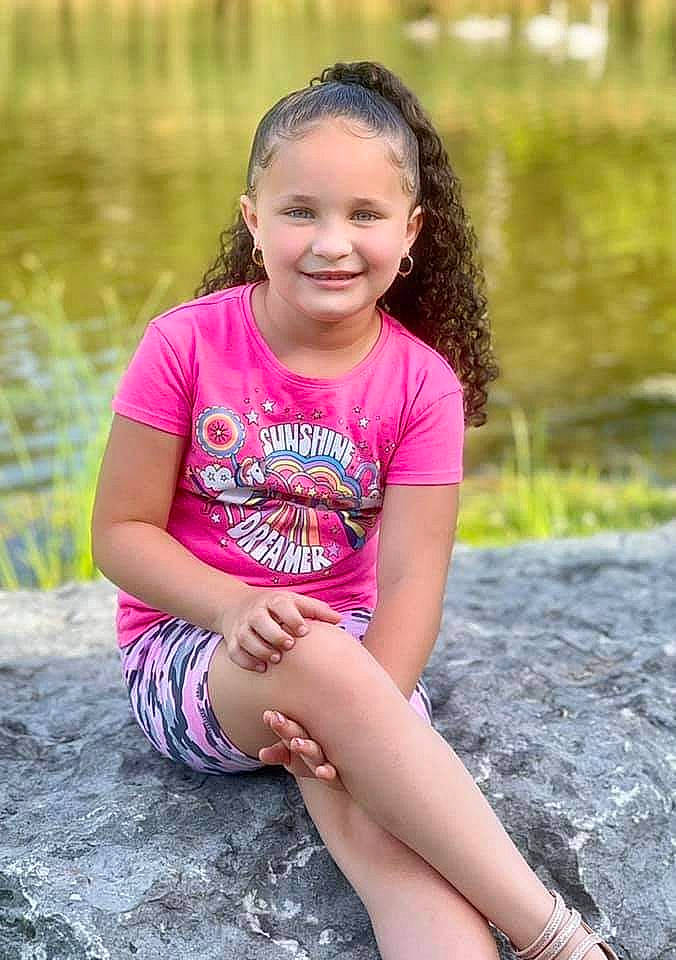 Aiyanna joined the competition — help win amazing prizes! black_hair, child, eye, face, flash_photography, grass, hairstyle, happy, joy, knee, leisure, lip, long_hair, people_in_nature, person, plant, skin, smile, summer, t_shirt