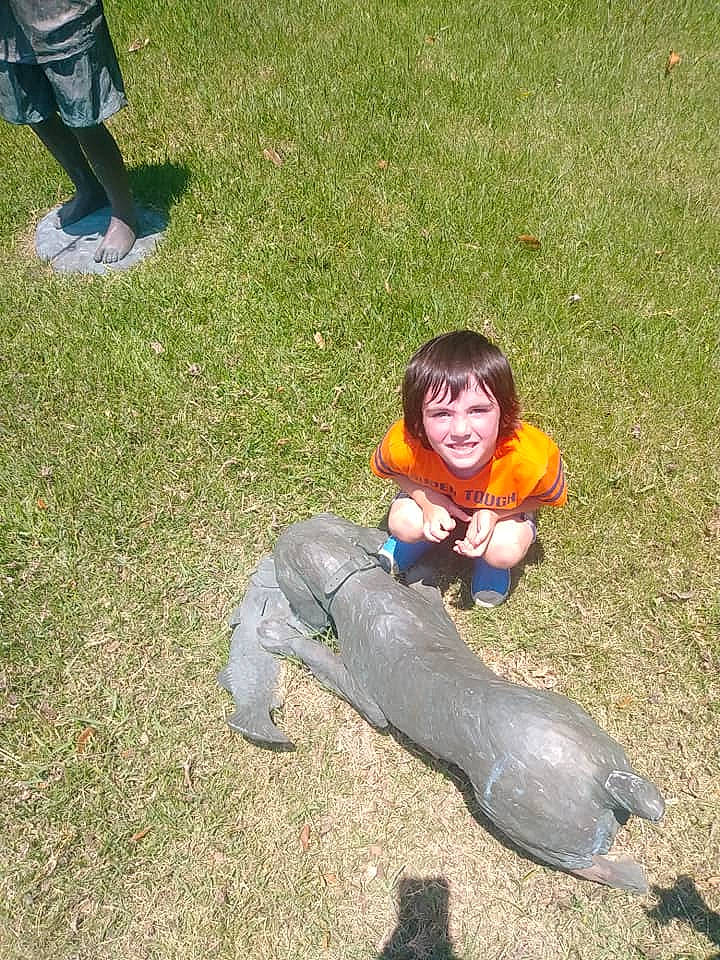 Dale is registered to the contest to win money with this photo: child, fun, grass, joy, lawn, leisure, person, plant, sitting