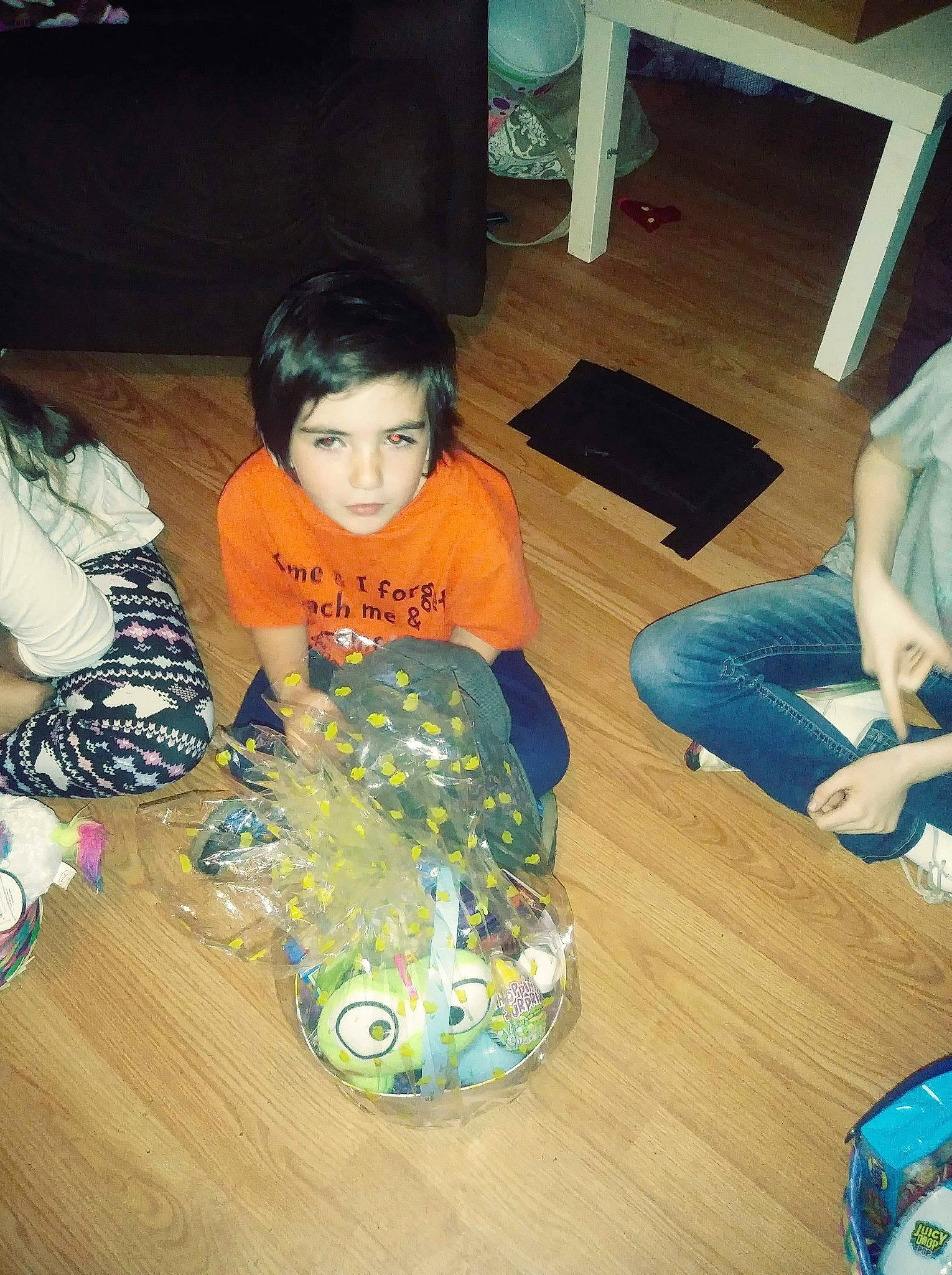 Dale is registered to the contest to win money with this photo: black_hair, electronic_device, floor, flooring, fun, hardwood, person, play, room, sitting