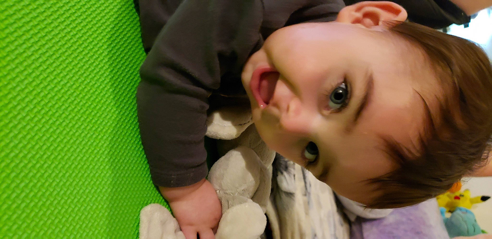 Leo is registered to the contest to win money with this photo: baby, cheek, ear, eyebrow, eyelash, finger, fun, gesture, grass, green, happy, human_body, iris, jaw, lip, mouth, neck, nose, person, skin