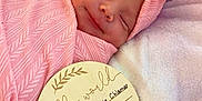 Demi joined the competition — help win amazing prizes! announcement, baby, baby_clothing, blanket, bow, closeup, cute, headband, indoors, infant, newborn, peaceful, pink, plush, portrait, resting, sleeping, smile, soft, wooden_plaque