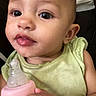 baby, baby_bottle, bottle, child, close_up, eyes, face, feeding, green_clothing, hand, indoor, infant, innocent, looking_at_camera, person, photography, pink, portrait, sitting, smiling