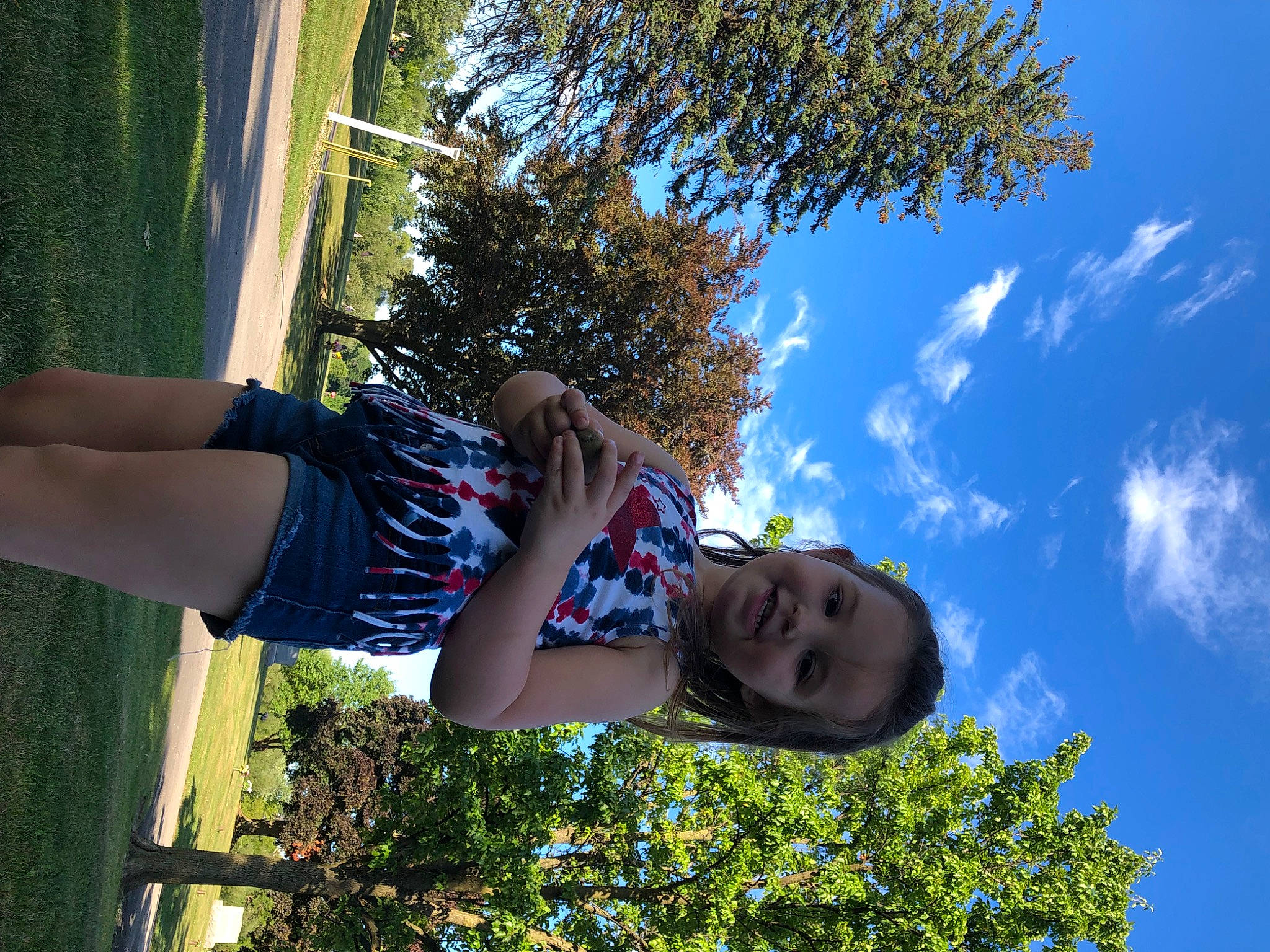 Noelle is registered to the contest to win money with this photo: arm, branch, cloud, cool, daytime, eyewear, grass, green, hairstyle, happy, human_body, joy, leaf, light, nature, people_in_nature, person, plant, sky, sunlight