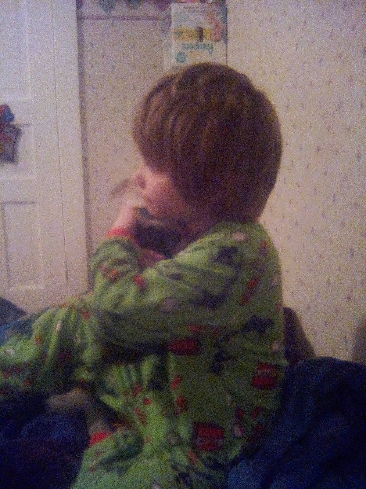 Chris is registered to the contest to win money with this photo: baby, child, comfort, door, ear, elbow, flooring, fun, happy, linens, pattern, person, play, reading, room, sitting, sleeve, t_shirt, toddler, visual_arts