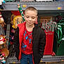 Christopher joined the competition — help win amazing prizes! child, boy, jacket, red_shirt, spiderman, jeans, store, shelf, christmas, candy_cane, decorations, plush_toy, holiday, smile, indoor, retail, clothing, person, festive, toys