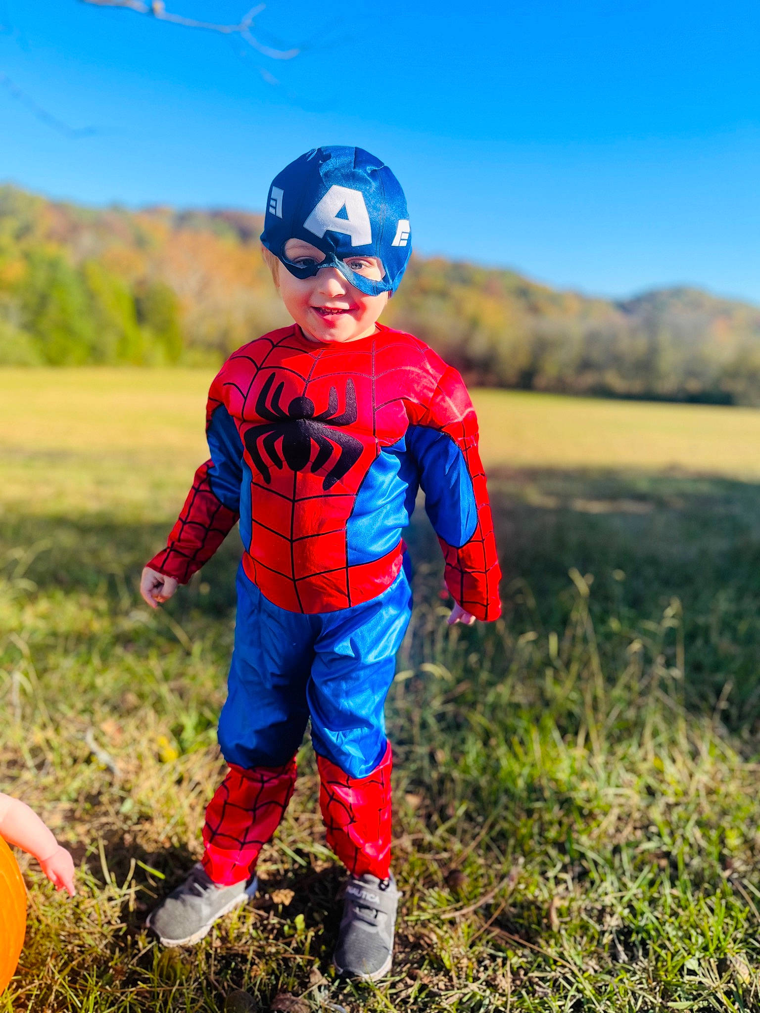 Jackson joined the competition — help win amazing prizes! agriculture, boot, child, cool, electric_blue, field, fun, grass, grassland, happy, helmet, joy, landscape, outerwear, people_in_nature, person, personal_protective_equipment, recreation, sky, soil