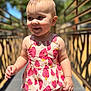 toddler, child, smiling, dress, strawberry_pattern, outdoor, sunlight, shadows, walking, happy, cute, portrait, baby, summer, daylight, person, expression, nature, playful, young_child