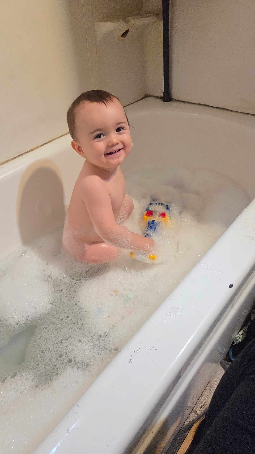 Anthony joined the competition — help win amazing prizes! toddler, bathtub, bath_bubbles, toy, smiling, child, water, foam, indoor, playing, happy, face, skin, hair, bathroom, sitting, person, cute, clean, young