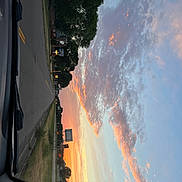 Marshall is registered to the contest to win money with this photo: atmosphere, automotive_lighting, car, city, cloud, evening, geological_phenomenon, heat, hood, landscape, morning, reflection, sky, space, tints_and_shades, vehicle, vehicle_door, water, window, world