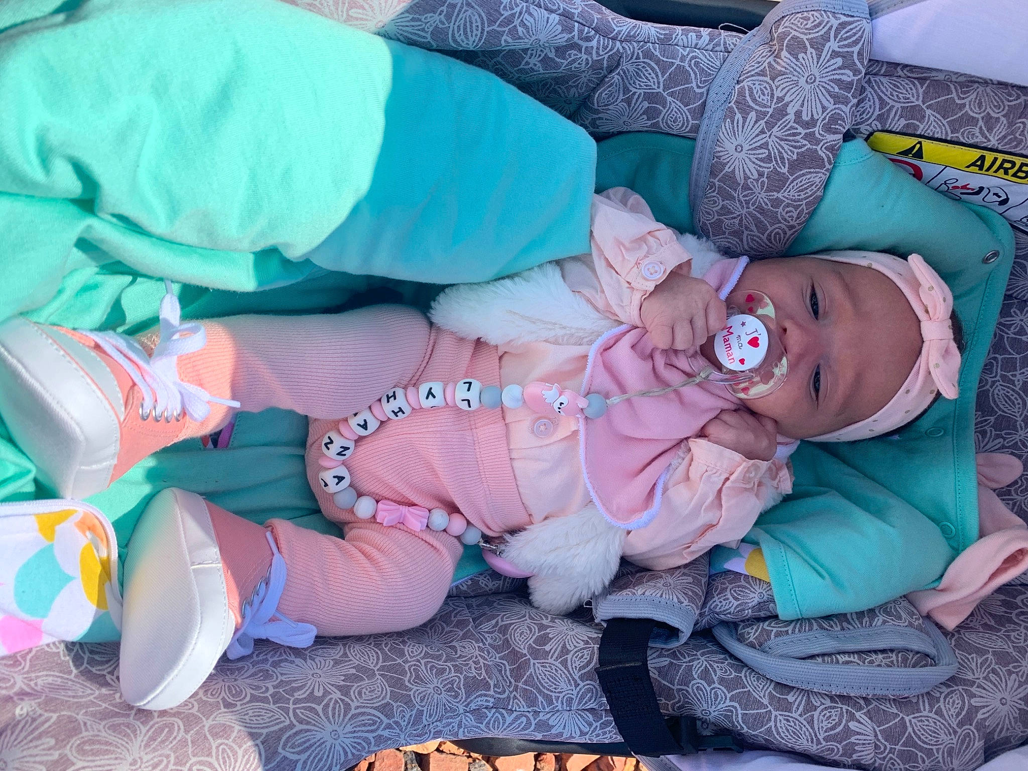 Lyhana participe au concours pour gagner de l'argent avec cette photo : baby, baby_products, baby_toddler_clothing, bedding, bedtime, child, comfort, grass, headwear, lap, linens, magenta, nap, pattern, person, pink, product, purple, sitting, sleep