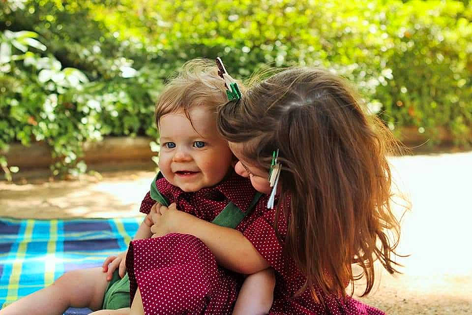 Casey joined the competition — help win amazing prizes! baby, botany, dress, fun, grass, happy, leaf, leisure, nature, pattern, people_in_nature, person, plaid, plant, recreation, smile, sunlight, tartan, toddler, tree