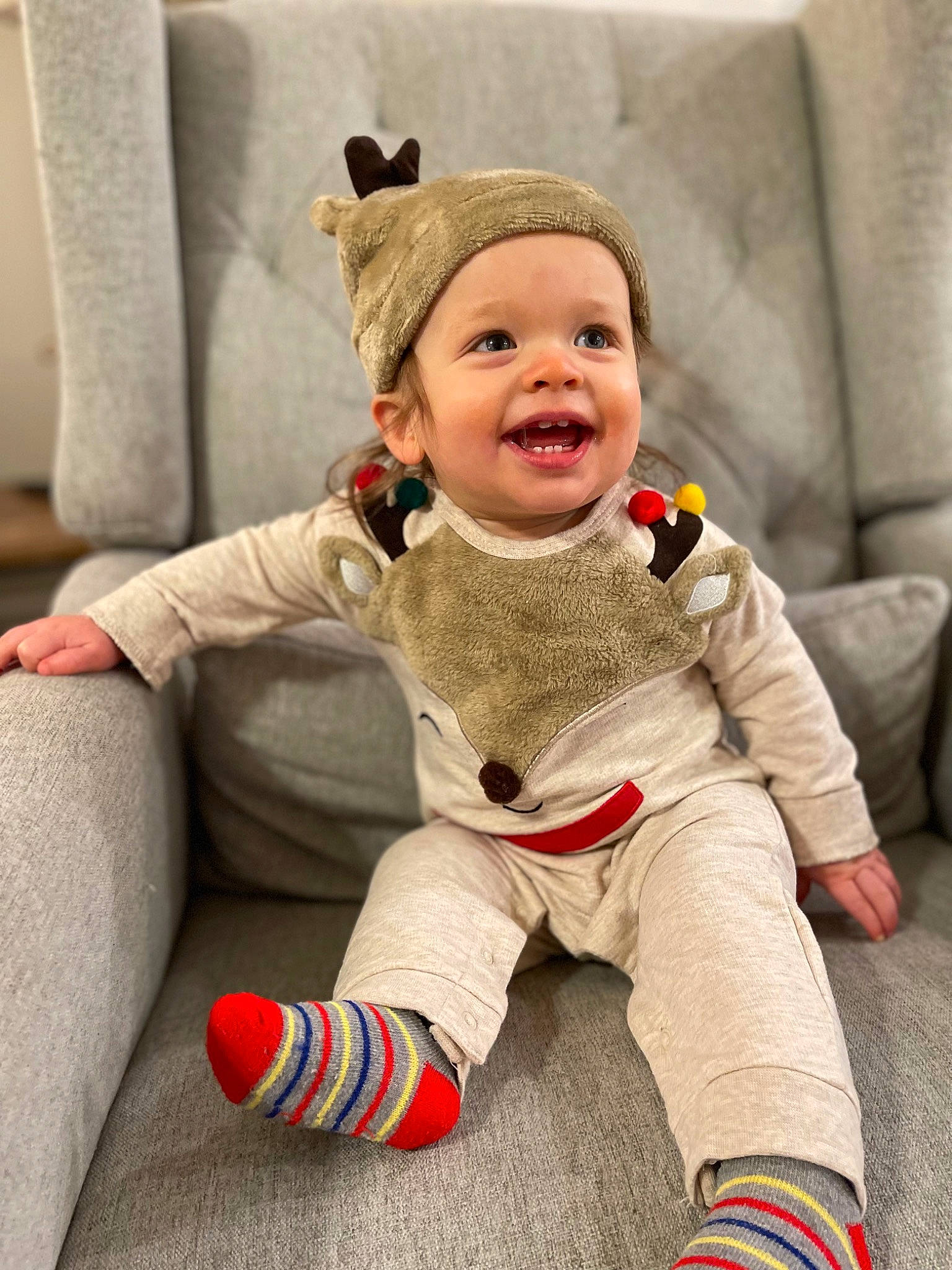 Archie joined the competition — help win amazing prizes! baby, baby_toddler_clothing, child, comfort, eye, flooring, foot, happy, headwear, human_body, jacket, joy, outerwear, person, sitting, skin, sleeve, smile, sock, textile