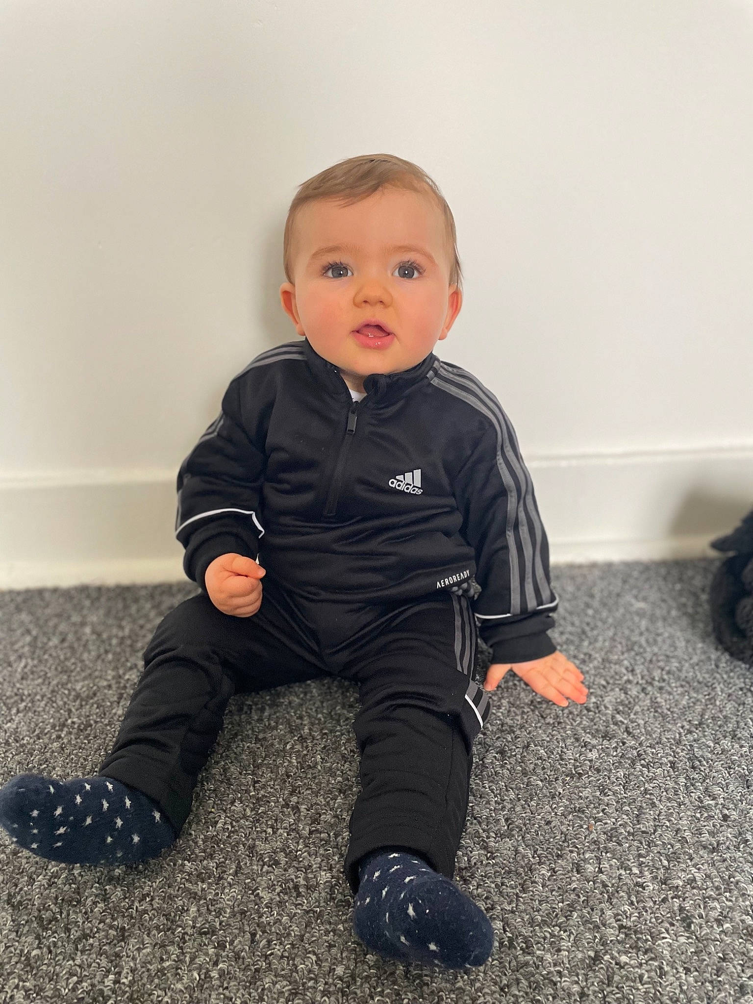 Koby is registered to the contest to win money with this photo: baby, baby_toddler_clothing, cheek, child, comfort, electric_blue, eye, flash_photography, flooring, human_leg, knee, person, sitting, sleeve, toddler