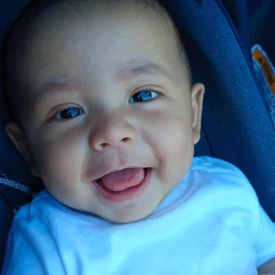 Lorenzo joined the competition — help win amazing prizes! baby, babylaughing, bodypart, clothing, cushion, face, finger, hand, happy, head, laughing, mouth, newborn, pants, person, photography, portrait, smile, t_shirt, teeth