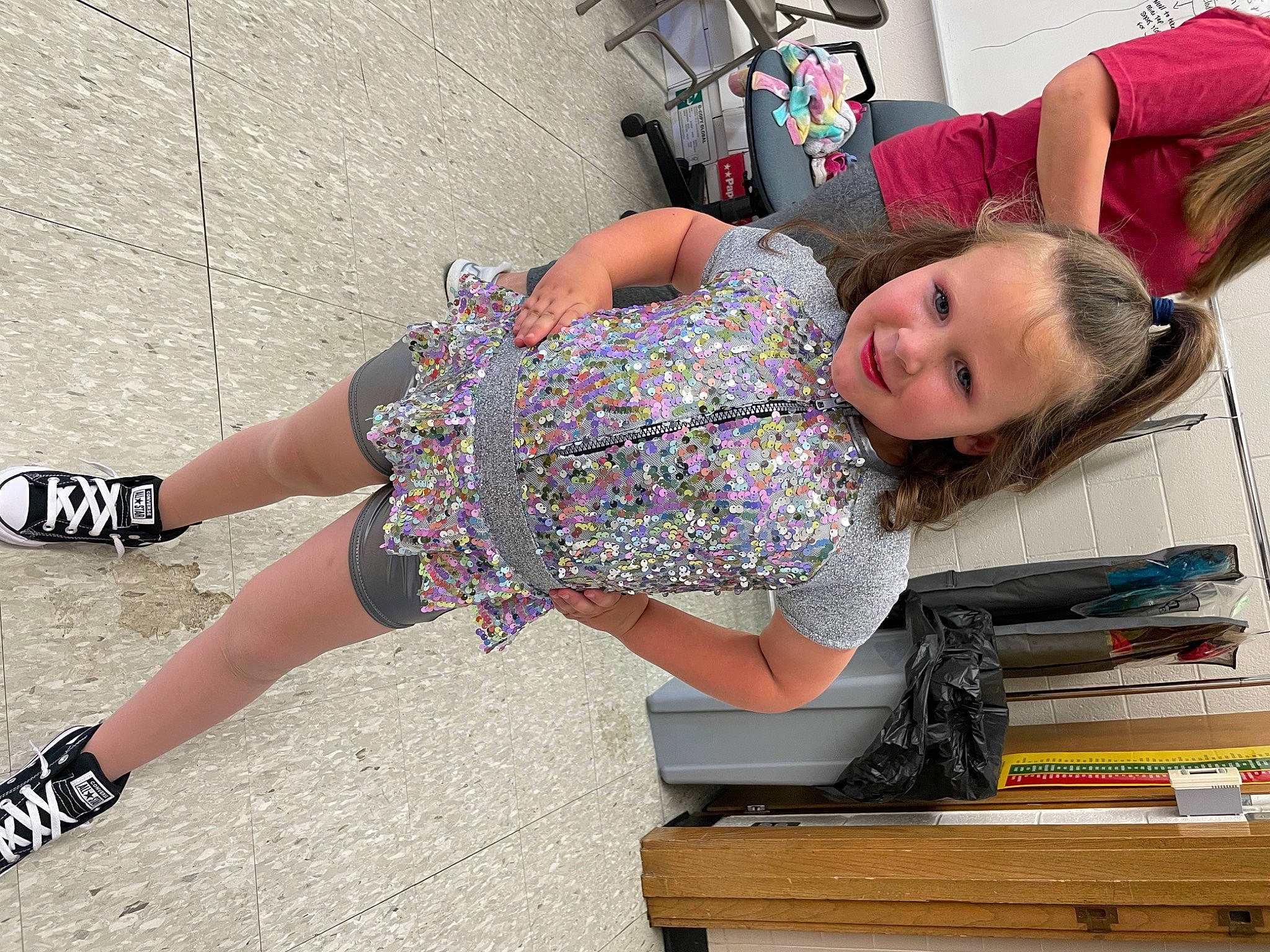 Clemintine is registered to the contest to win money with this photo: blond, calf, electric_blue, eyewear, fun, happy, human_leg, joint, joy, knee, leisure, pattern, person, pink, shoe, shoulder, sitting, smile, street_fashion, thigh