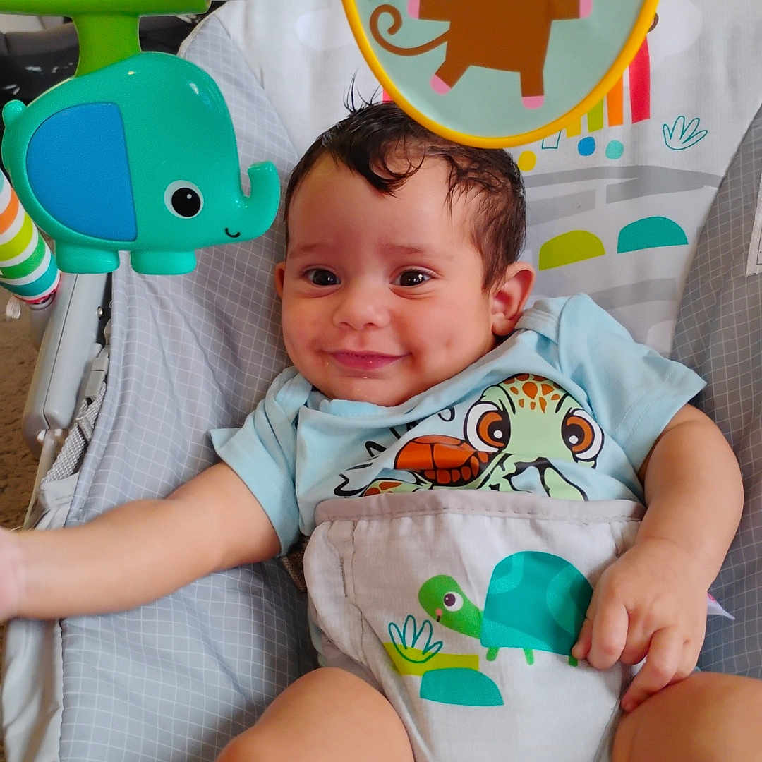 Levi joined the competition — help win amazing prizes! baby, baby_rocker, child, childcare, clothing, colorful, cute, elephant, face, frog, happy, indoor, infant, monkey, person, playful, seat, smiling, toddler, toy