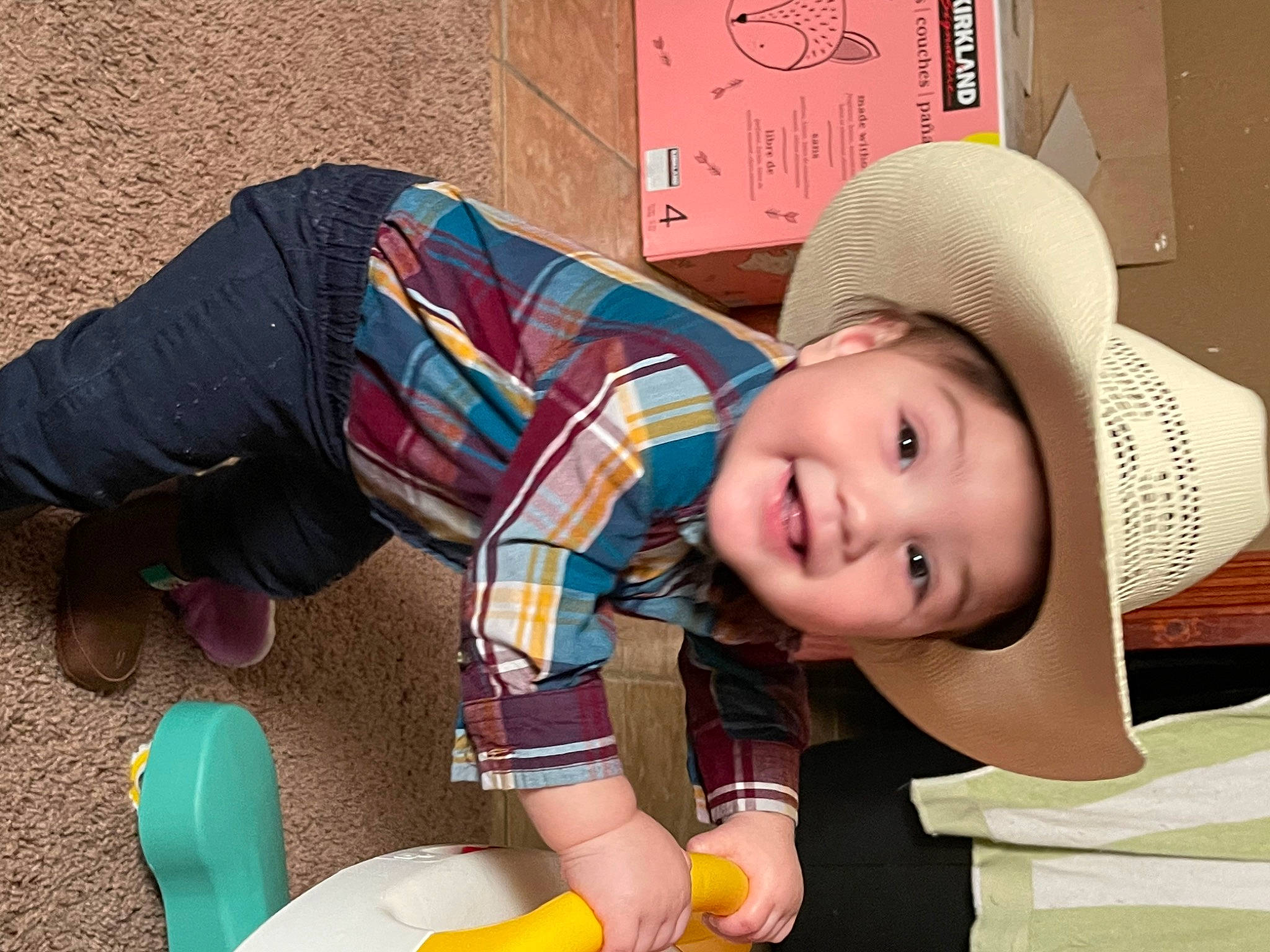 Luis is registered to the contest to win money with this photo: baby, baby_playing_with_toys, baby_toddler_clothing, cap, child, fashion_accessory, fun, happy, hat, headwear, helmet, joy, leisure, pattern, people, person, pink, sitting, smile, sun_hat