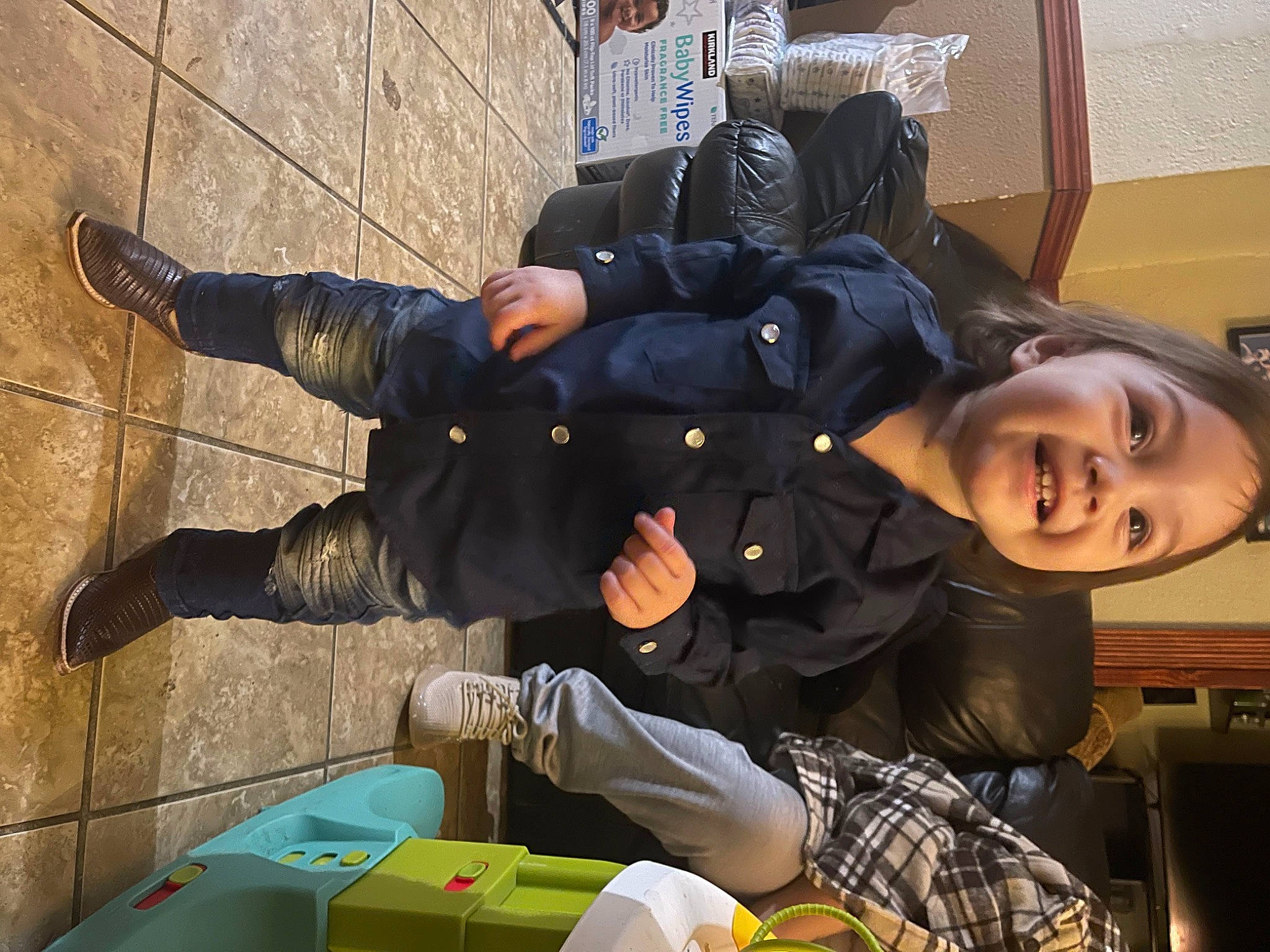 Luis joined the competition — help win amazing prizes! comfort, fun, human_leg, jacket, joy, leg, person, plaid, sitting, smile, tartan, thigh, travel