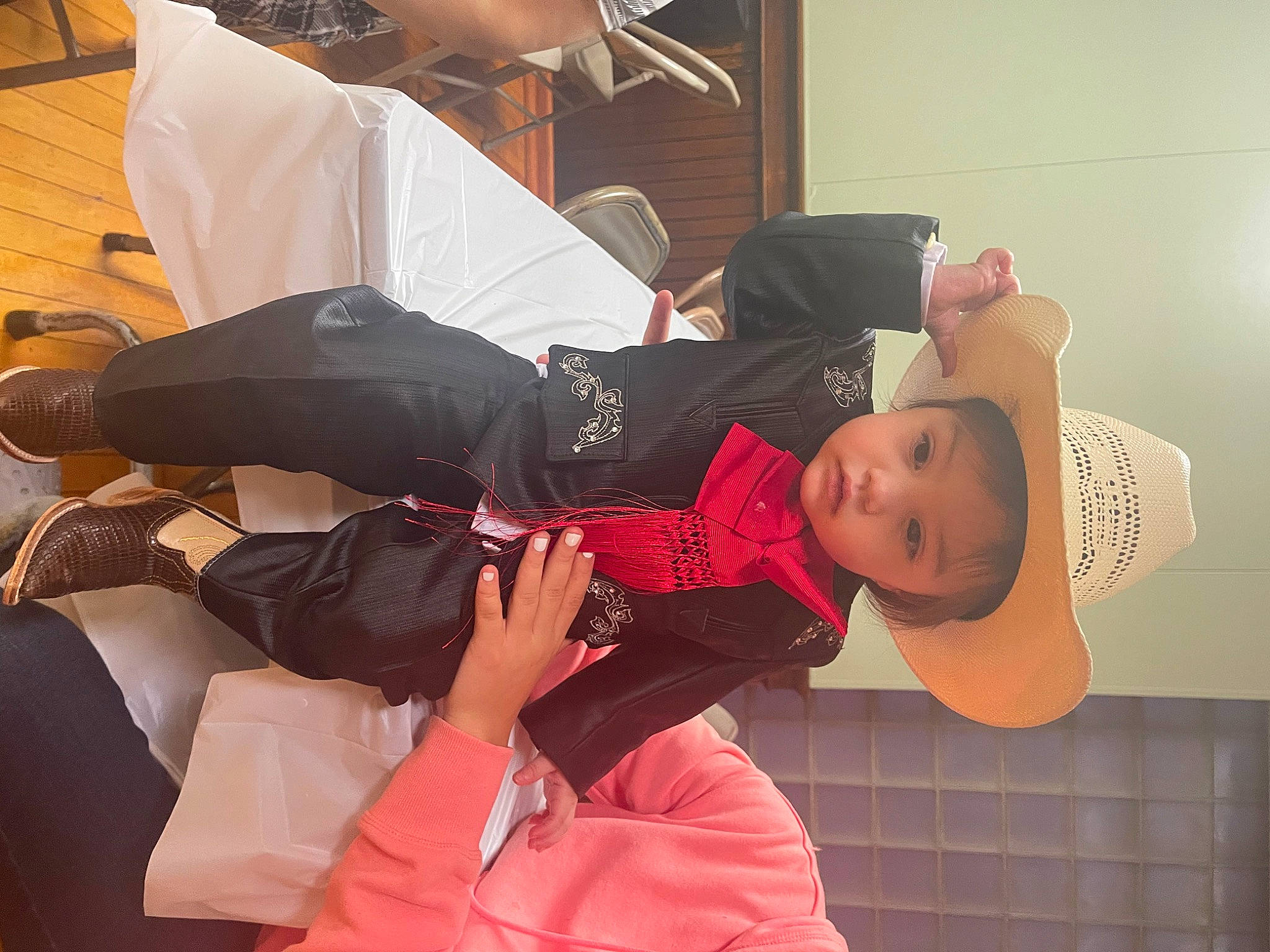 Luis is registered to the contest to win money with this photo: baby, baby_toddler_clothing, carmine, child, comfort, costume, event, fun, hat, person, room, sitting, toddler, umbrella