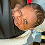 Derreck Jr is registered to the contest to win money with this photo: baby, infant, person, face, skin, hair, blanket, clothing, bottle, couch, room, indoor, closeup, newborn, head, expression, comfort, child, care, soft