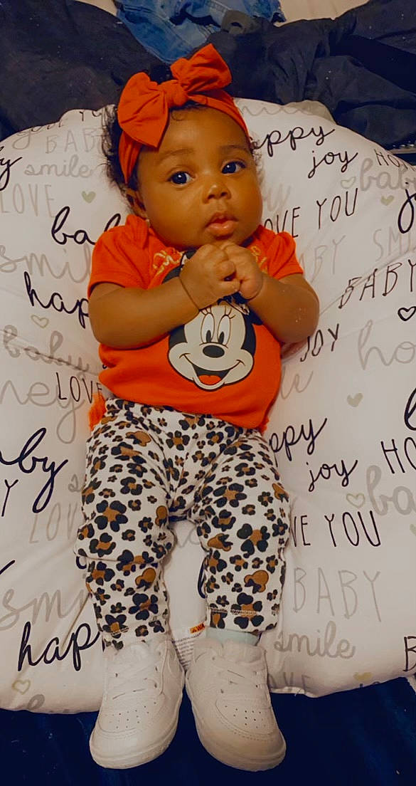 Jai Lynn is registered to the contest to win money with this photo: abdomen, active_pants, baby, baby_products, baby_toddler_clothing, camouflage, child, handwriting, headband, headpiece, leggings, mammal, nightwear, orange, pajamas, peach, person, sweatpant, toddler