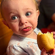 Rylo joined the competition — help win amazing prizes! toddler, child, face, blue_eyes, bread, food, hand, clothing, indoor, portrait, expression, cute, messy, eating, curious, young_child, skin, hair, person, closeup