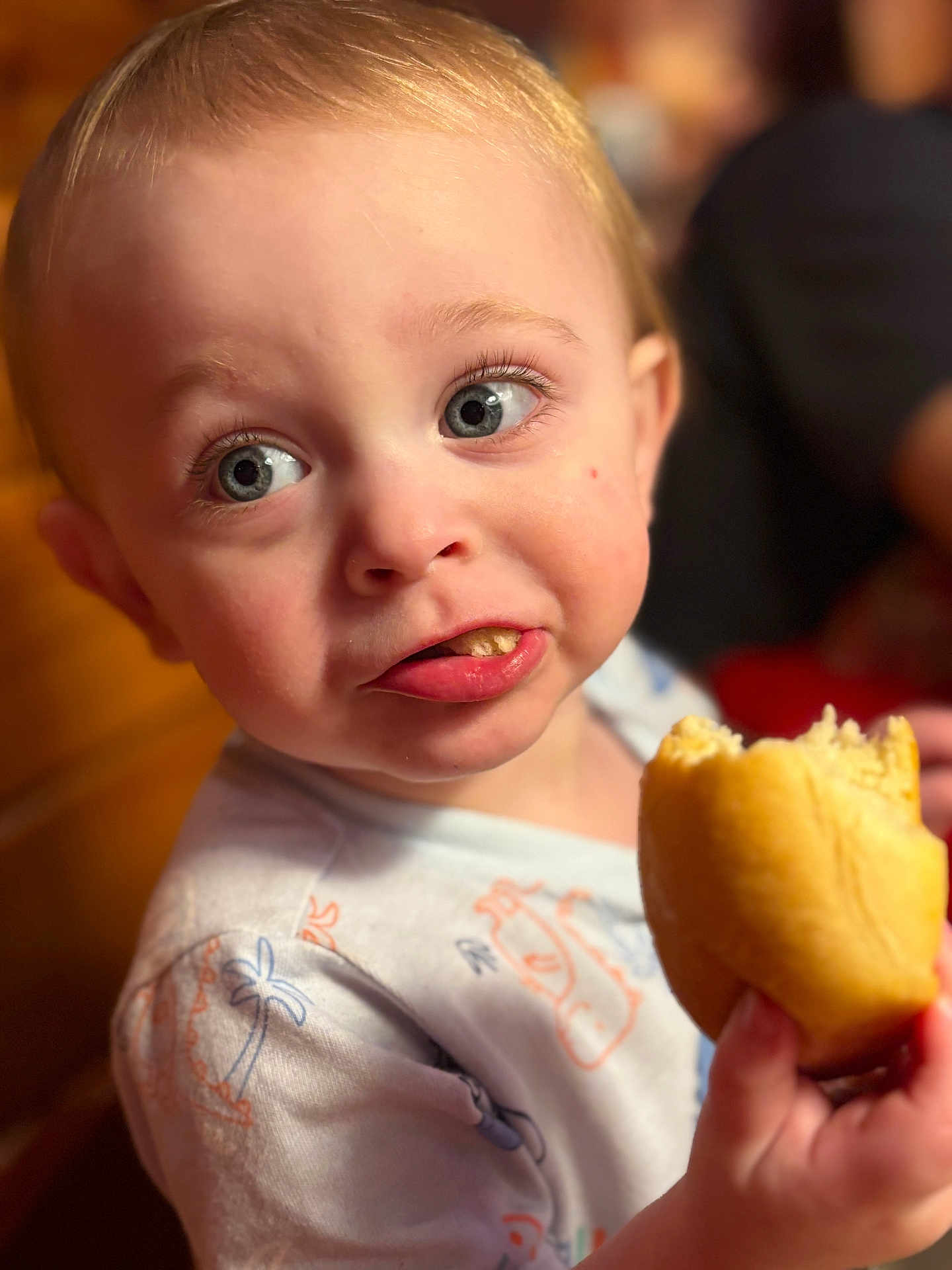 Rylo joined the competition — help win amazing prizes! toddler, child, face, blue_eyes, bread, food, hand, clothing, indoor, portrait, expression, cute, messy, eating, curious, young_child, skin, hair, person, closeup