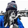 cat, person, hat, winter_clothing, leash, outdoor, snow, blue_jacket, black_and_white_cat, knitted_hat, cold_weather, animal, pet, feline, fur, whiskers, eyes, hand, holding, background