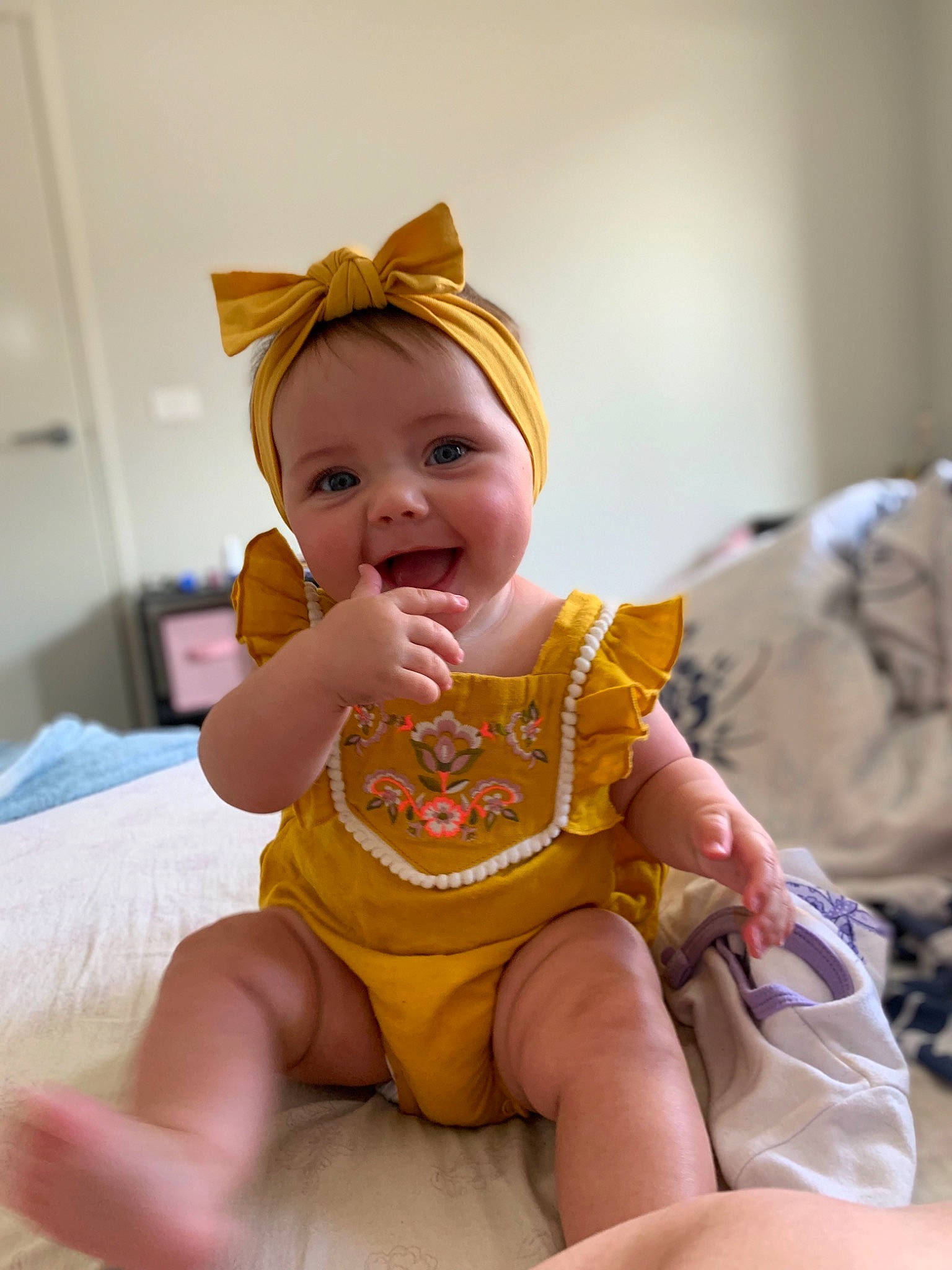 Eliza Grace joined the competition — help win amazing prizes! baby, child, ear, facial_expression, human_leg, person, play, sitting, skin, smile, toddler, vacation, yellow