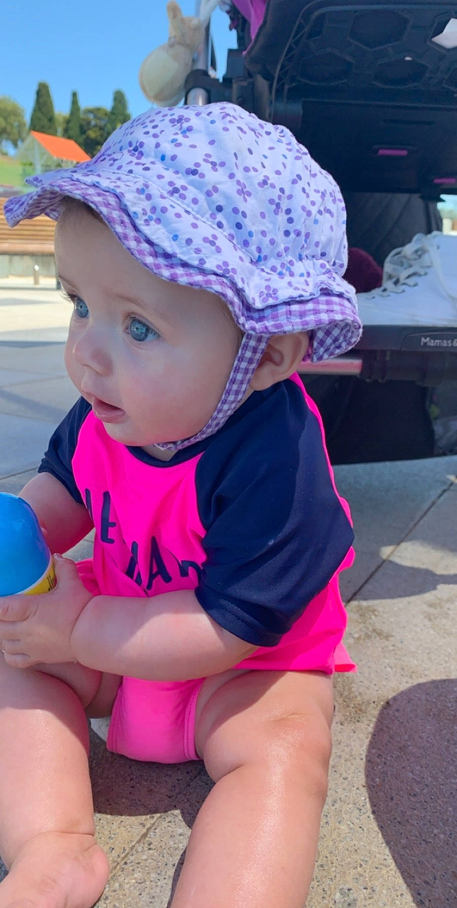 Eliza Grace joined the competition — help win amazing prizes! baby, bonnet, cap, child, clothing, fashion_accessory, hat, headgear, headwear, leg, person, personal_protective_equipment, pink, play, purple, skin, sun_hat, thigh, toddler, vacation