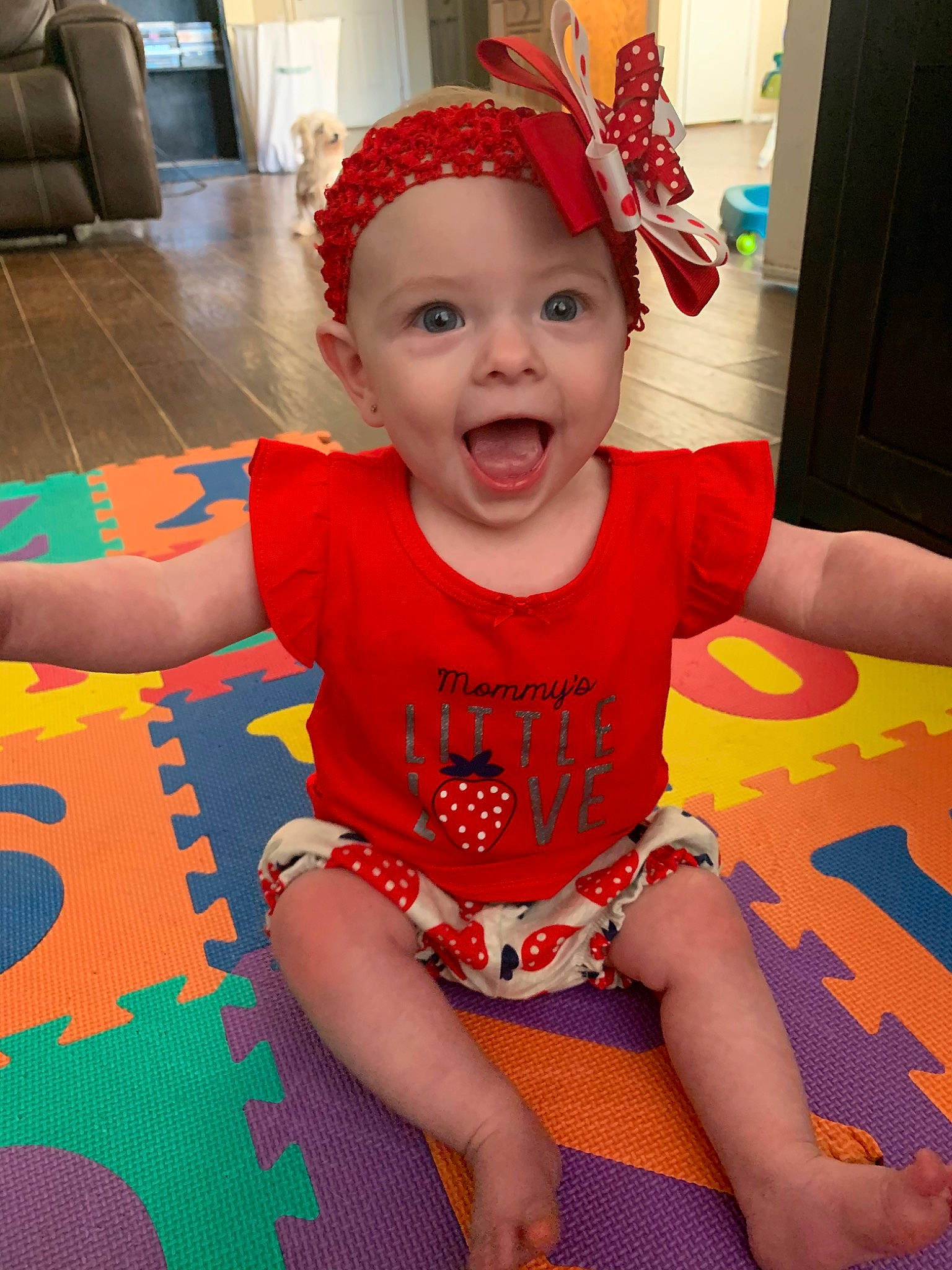 Quinnlee is registered to the contest to win money with this photo: baby, baby_toddler_clothing, cheek, child, costume, face, fun, hair_accessory, head, headband, headgear, headwear, person, play, red, sitting, skin, smile, surprise, toddler