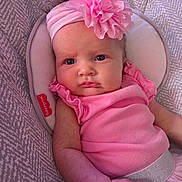 Harper joined the competition — help win amazing prizes! baby, infant, pink, headband, flower, clothing, cushion, seat, face, portrait, child, person, cute, expression, indoors, soft, skin, closeup, fashion, accessory