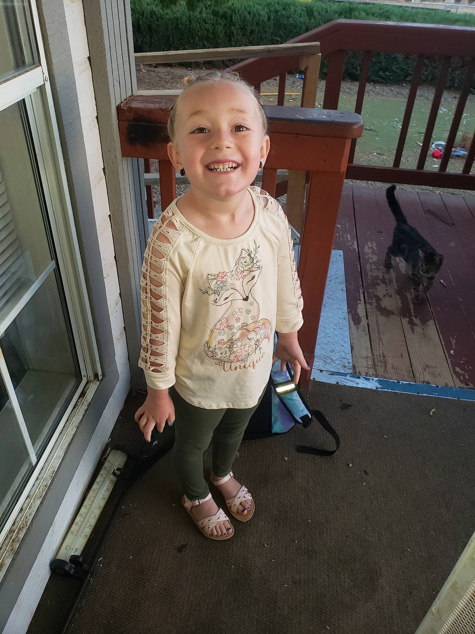 Evelynn is registered to the contest to win money with this photo: baby, baby_toddler_clothing, eye, face, flooring, grass, happy, hardwood, joy, leg, leisure, mammal, outdoor_furniture, person, product, sleeve, smile, t_shirt, toddler, vertebrate