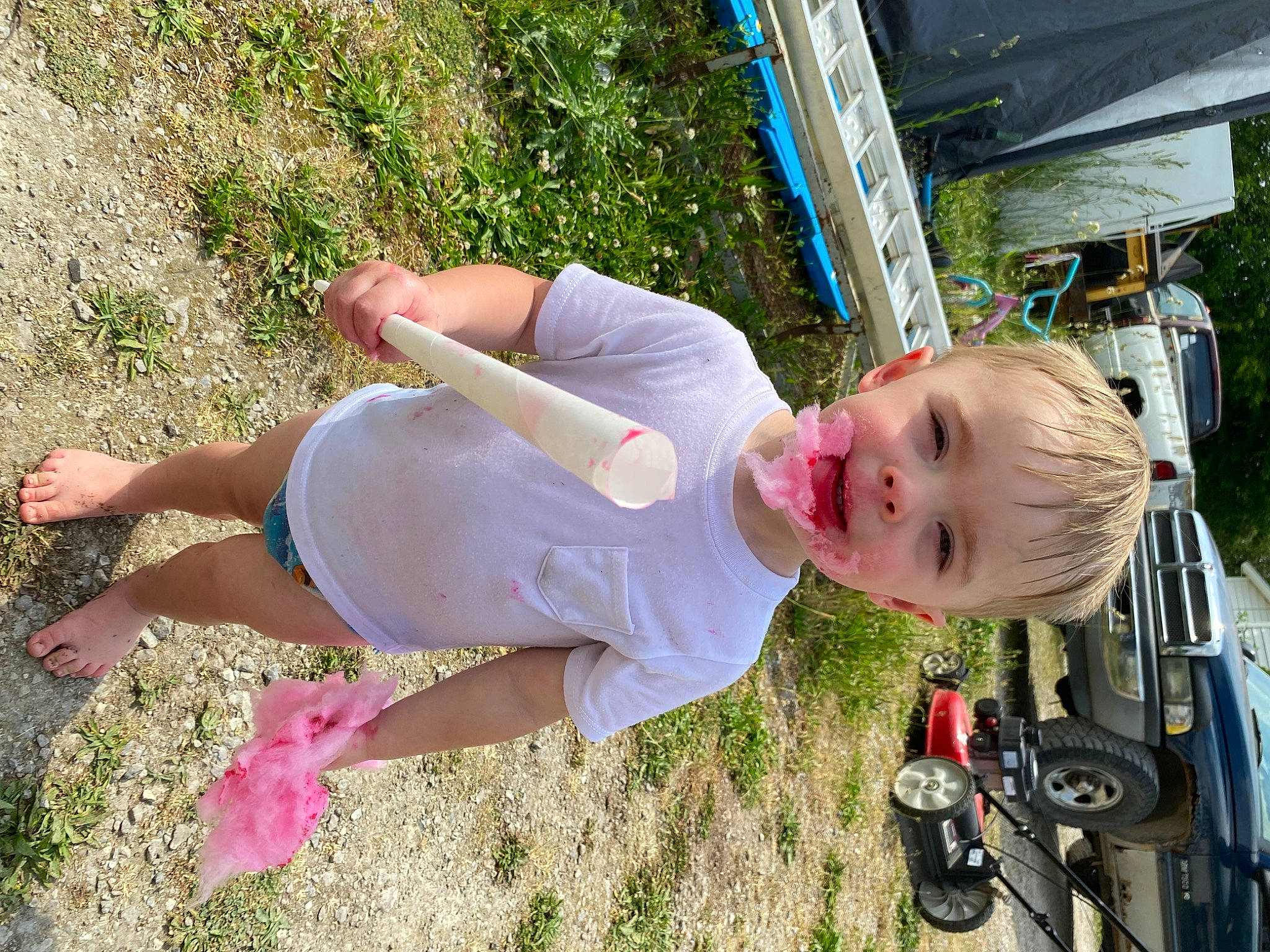 Roman is registered to the contest to win money with this photo: automotive_exterior, baby, car, child, family_car, fun, grass, happy, leisure, motor_vehicle, people_in_nature, person, plant, recreation, smile, tire, toddler, tree, vehicle, vehicle_door