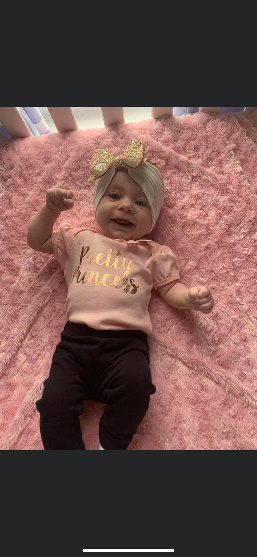 Crystal joined the competition — help win amazing prizes! baby, baby_toddler_clothing, child, font, fun, happy, headwear, laugh, magenta, party_supply, person, personal_protective_equipment, photo_caption, pink, play, room, selfie, sleeve, smile, sportswear