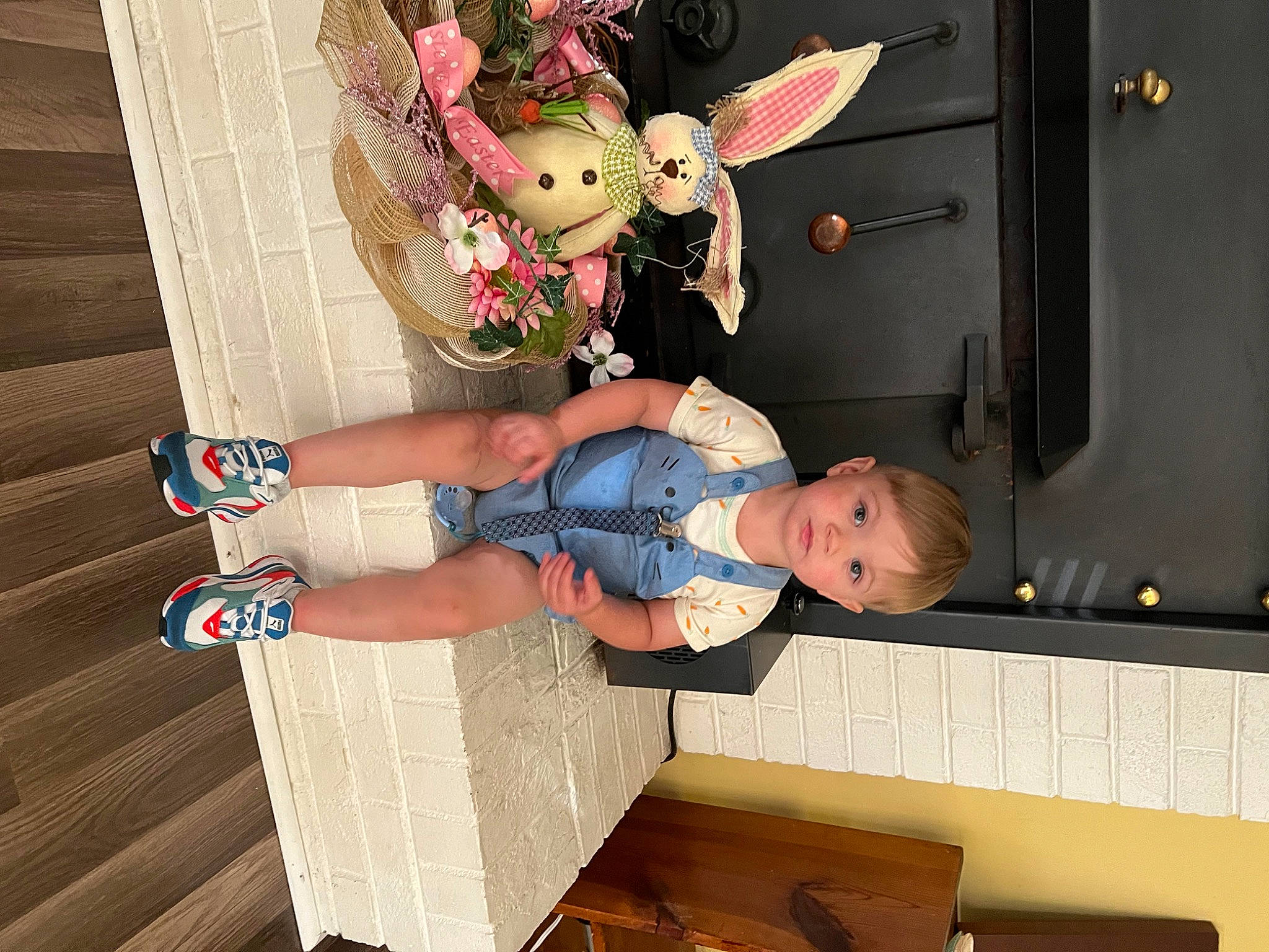 Brentley joined the competition — help win amazing prizes! baby_toddler_clothing, child, fun, hardwood, human_leg, person, room, smile, sock, thigh, toddler, toy, wood
