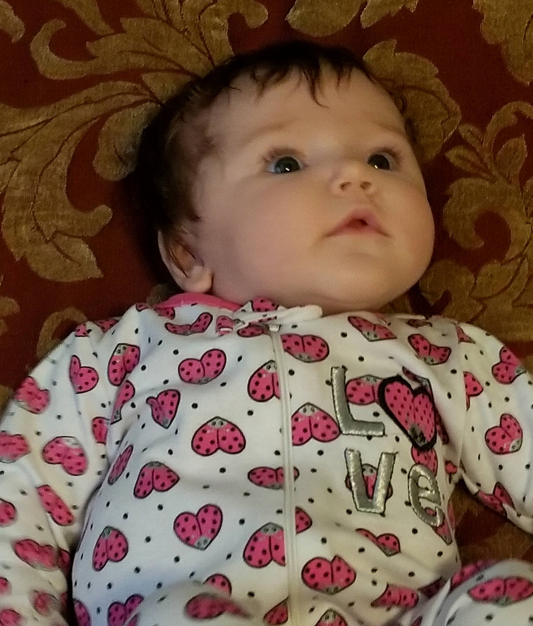 Greysen is registered to the contest to win money with this photo: baby, baby_toddler_clothing, cheek, chin, collar, eyelash, face, facial_expression, iris, lip, neck, nose, organ, outerwear, pattern, person, pink, skin, sleeve, textile