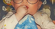 Skyler is registered to the contest to win money with this photo: animated_cartoon, animation, child, doll, eyewear, fiction, fictional_character, fun, gesture, glasses, happy, hat, illustration, recreation, selfie, thumb, toddler, toy, vision_care, world