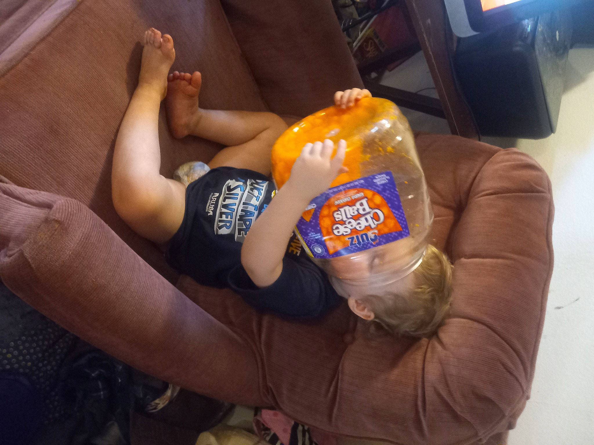 Hunter is registered to the contest to win money with this photo: arm, bottle, child, comfort, computer_keyboard, drink, drinking, elbow, electric_blue, foot, gesture, hand, human_leg, knee, nail, person, plastic_bottle, soft_drink, thigh, thumb