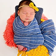 Koda is registered to the contest to win money with this photo: newborn, baby, sleeping, wrapped, blanket, headband, yellow_bow, blue_stripes, pink_blanket, yellow_blanket, cozy, soft, cute, portrait, infant, peaceful, tiny_feet, hands, studio, white_background