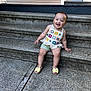 toddler, child, smiling, sitting, steps, concrete, outdoor, happy, footwear, sandals, shorts, crochet_top, bracelet, earrings, person, portrait, urban, daylight, cute, playful