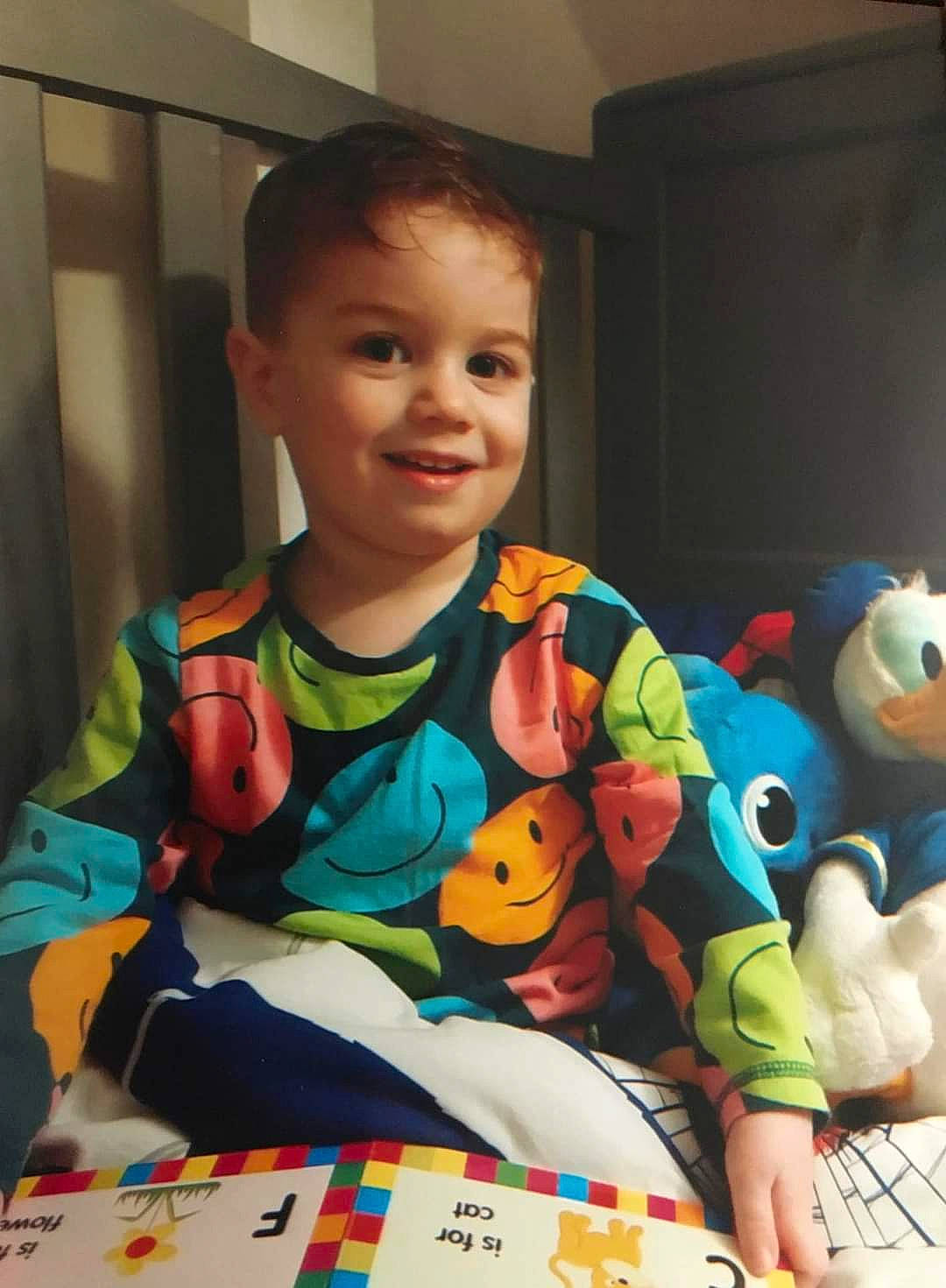 Tommy Craig is registered to the contest to win money with this photo: baby, baby_playing_with_toys, baby_toddler_clothing, baby_toys, child, event, flooring, fun, happy, holiday, indoor_games_and_sports, joy, pattern, person, play, room, sharing, sitting, sleeve, smile