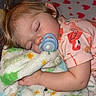 Koura is registered to the contest to win money with this photo: toddler, sleeping, pacifier, blanket, flamingo_pattern, shirt, child, playpen, heart_prints, cozy, nap, soft_texture, cute, face, arm, indoor, rest, peaceful, baby, young_child