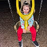 child, swing, playground, night, wood_chips, chains, smile, red_pants, blue_shirt, shoes, play, outdoor, fun, happy, seat, metal, toy, person, clothing, flash_photo