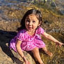 child, girl, pink_dress, water, rocks, outdoor, nature, boots, sunlight, shadow, playful, curious, sitting, summer, daylight, happy, portrait, young, water_edge, exploration