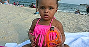 Jream is registered to the contest to win money with this photo: toddler, child, beach, sand, ocean, snorkel_mask, pink_bikini, hair_bows, blanket, sunny, sky, clouds, people, water, summer, vacation, sand_on_skin, swimwear, outdoor, portrait