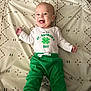 Greysen is registered to the contest to win money with this photo: baby, babylaughing, bed, clothing, crib, cushion, face, furniture, green, happy, head, homedecor, laughing, newborn, pants, person, photography, portrait, smile, t_shirt