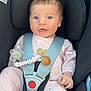 baby, infant, car_seat, harness, pacifier, pink_outfit, cute, child, seatbelt, safety, adorable, face, blue_eyes, clothing, small_hands, head_support, indoor, portrait, baby_girl, comfortable
